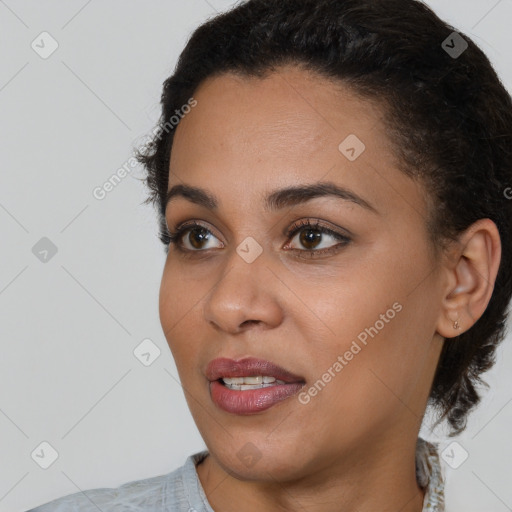 Joyful latino young-adult female with medium  brown hair and brown eyes