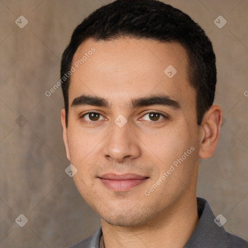 Joyful white young-adult male with short  black hair and brown eyes