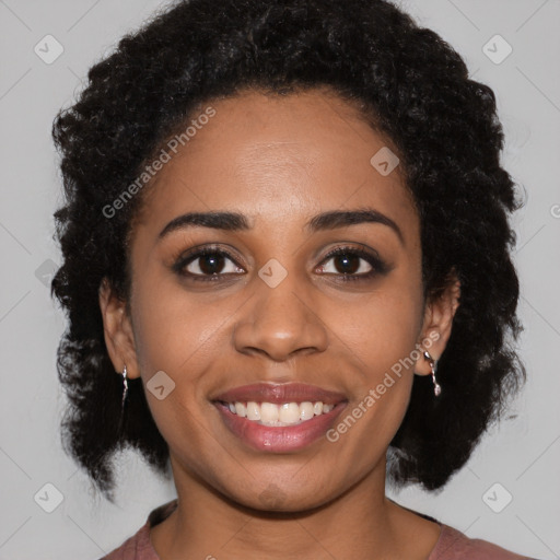 Joyful black young-adult female with medium  black hair and brown eyes