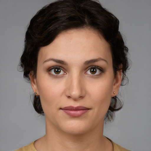 Joyful white young-adult female with medium  brown hair and brown eyes