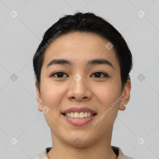 Joyful asian young-adult female with short  black hair and brown eyes