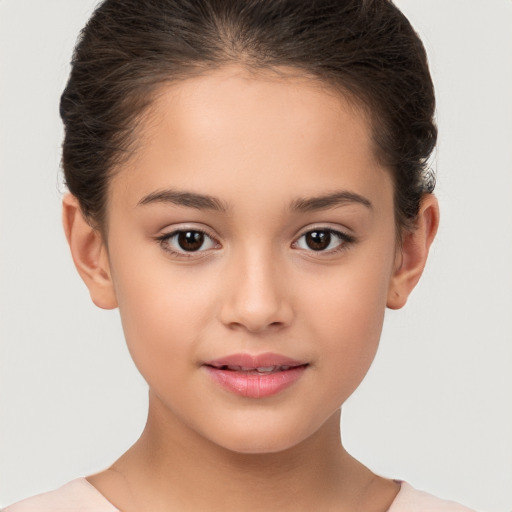 Joyful white child female with short  brown hair and brown eyes