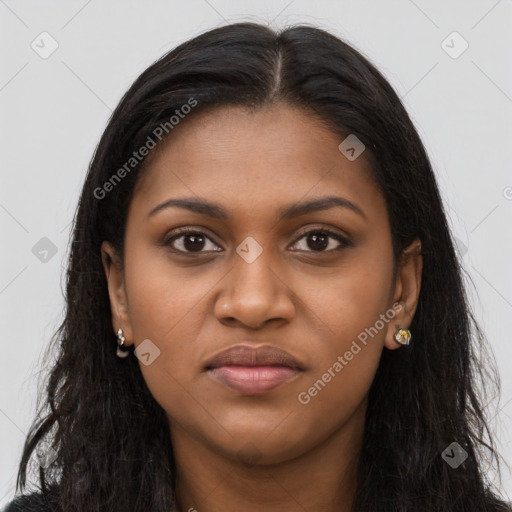 Joyful black young-adult female with long  brown hair and brown eyes