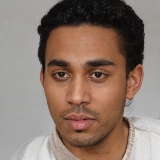 Neutral latino young-adult male with short  black hair and brown eyes