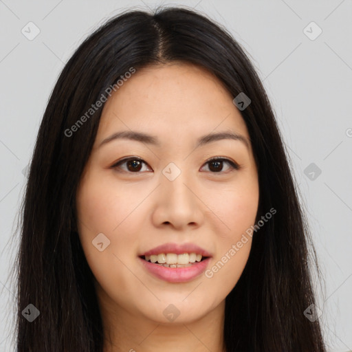 Joyful asian young-adult female with long  brown hair and brown eyes