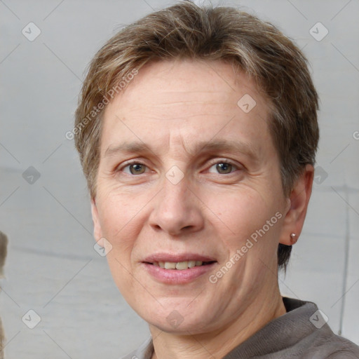 Joyful white adult male with short  brown hair and grey eyes