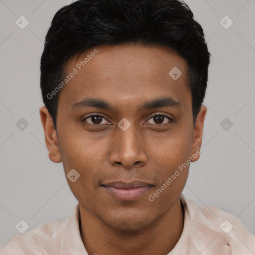 Joyful black young-adult male with short  black hair and brown eyes