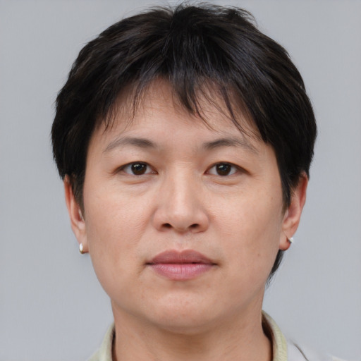 Neutral asian adult female with short  brown hair and brown eyes