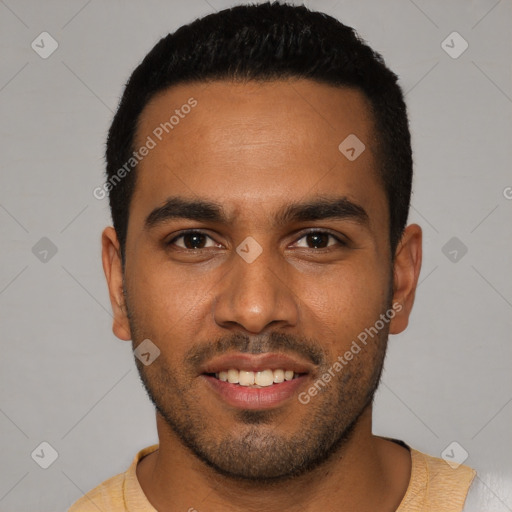 Joyful black young-adult male with short  black hair and brown eyes