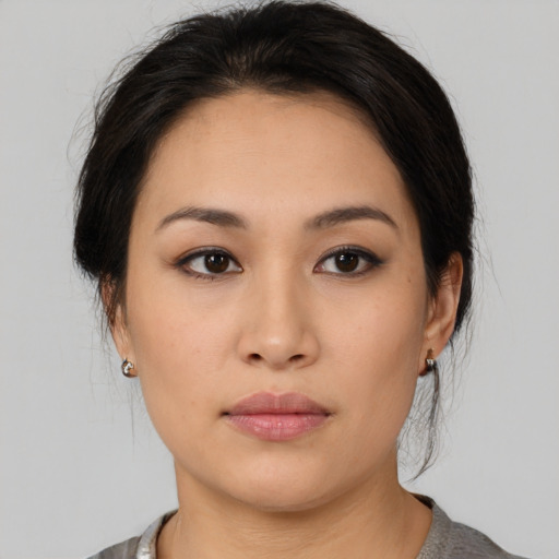 Neutral asian young-adult female with medium  brown hair and brown eyes