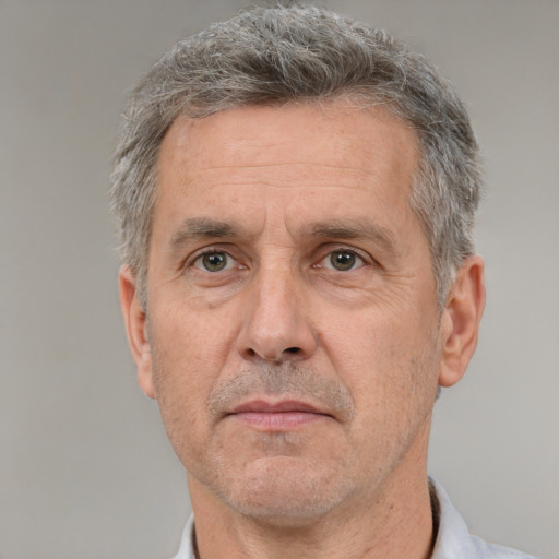 Neutral white middle-aged male with short  gray hair and brown eyes