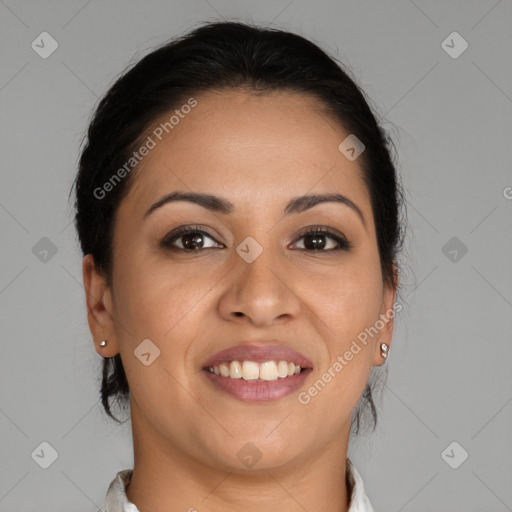 Joyful latino young-adult female with medium  brown hair and brown eyes