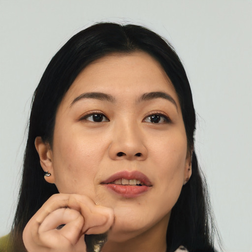 Joyful asian young-adult female with long  black hair and brown eyes
