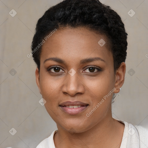 Joyful black young-adult female with short  black hair and brown eyes