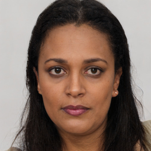 Neutral latino young-adult female with long  brown hair and brown eyes