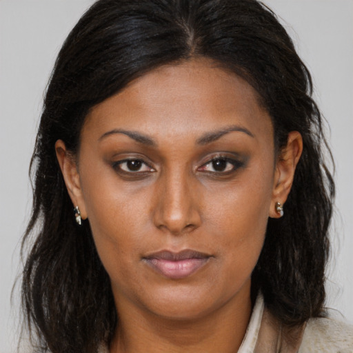 Neutral black young-adult female with medium  brown hair and brown eyes