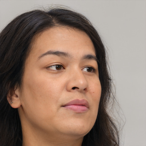 Joyful asian young-adult female with long  brown hair and brown eyes