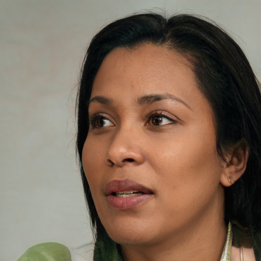 Joyful asian young-adult female with medium  black hair and brown eyes