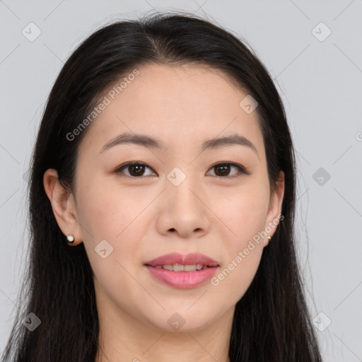 Joyful asian young-adult female with long  brown hair and brown eyes