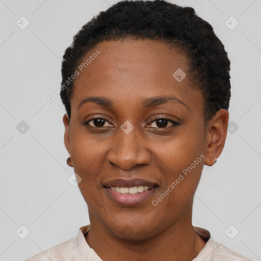 Joyful black young-adult female with short  black hair and brown eyes