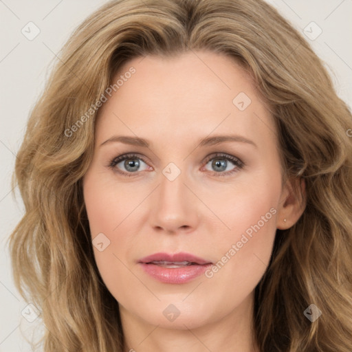 Joyful white young-adult female with long  brown hair and blue eyes