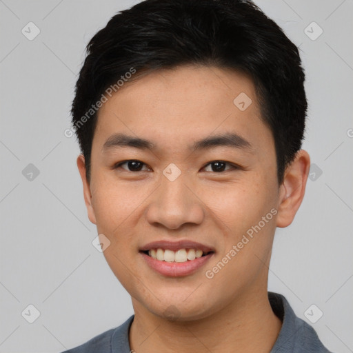 Joyful asian young-adult male with short  black hair and brown eyes