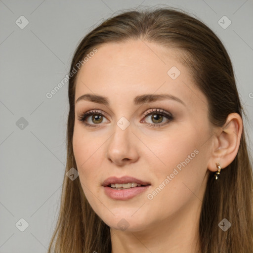 Joyful white young-adult female with long  brown hair and brown eyes