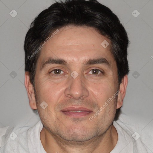 Joyful white adult male with short  black hair and brown eyes