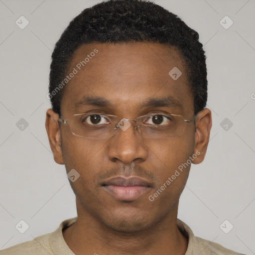 Neutral black young-adult male with short  black hair and brown eyes
