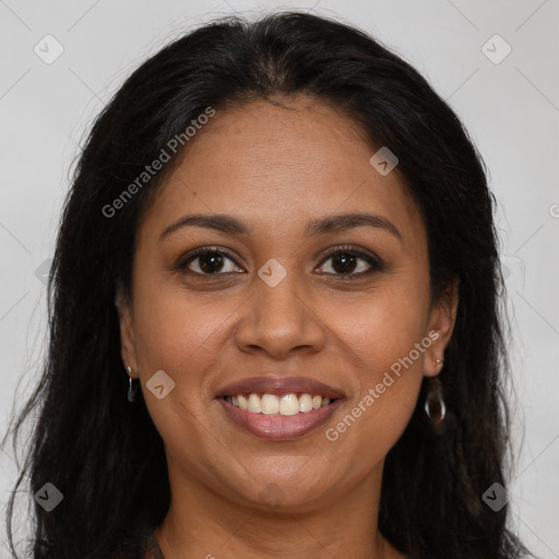 Joyful latino young-adult female with long  brown hair and brown eyes