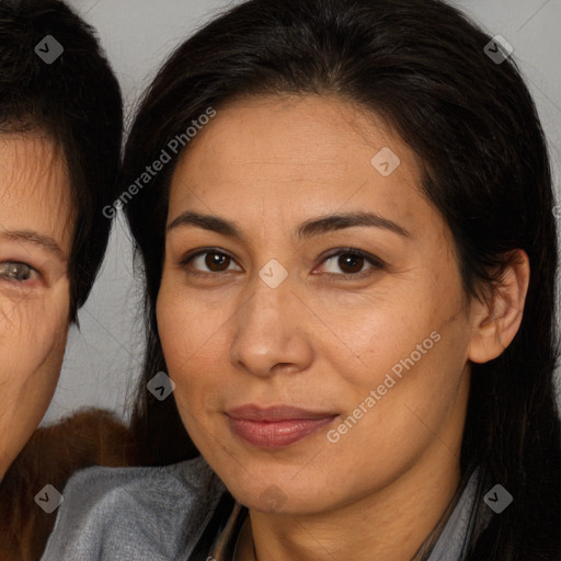 Joyful white adult female with long  brown hair and brown eyes