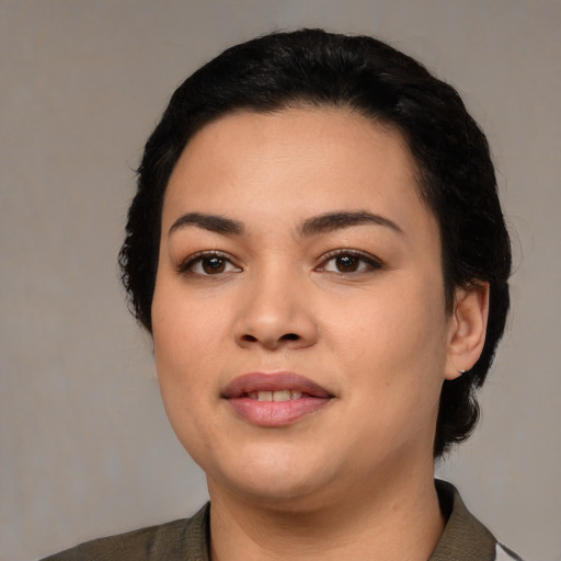 Joyful latino young-adult female with medium  black hair and brown eyes