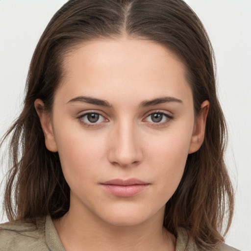 Neutral white young-adult female with long  brown hair and brown eyes