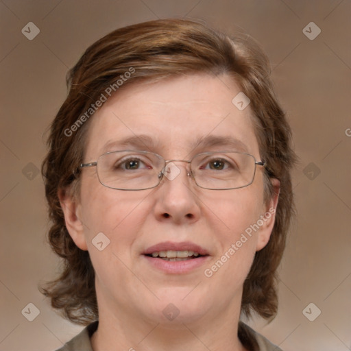 Joyful white adult female with medium  brown hair and blue eyes