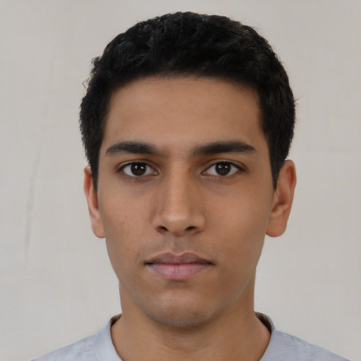 Neutral latino young-adult male with short  black hair and brown eyes