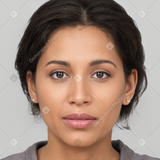 Joyful latino young-adult female with medium  brown hair and brown eyes