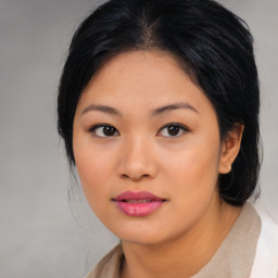 Joyful asian young-adult female with medium  black hair and brown eyes