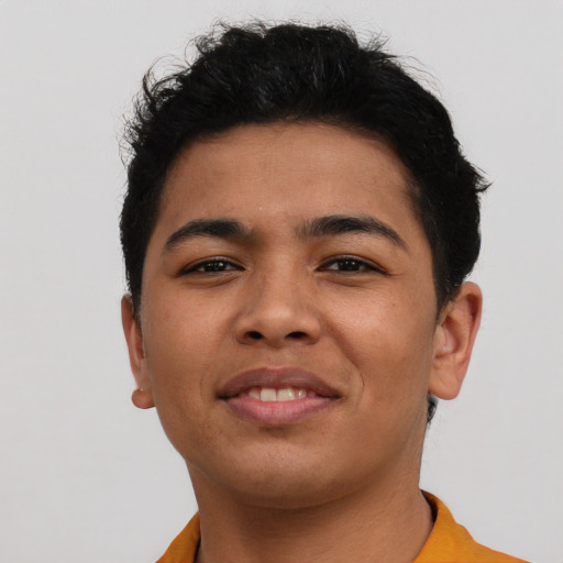 Joyful asian young-adult male with short  brown hair and brown eyes