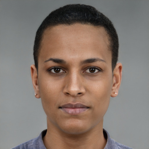 Joyful black young-adult female with short  brown hair and brown eyes