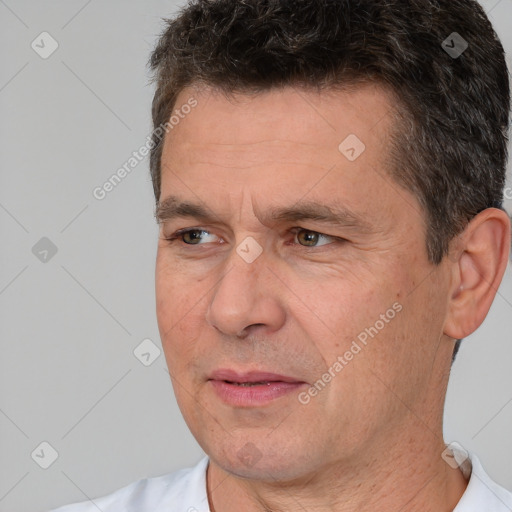 Joyful white adult male with short  brown hair and brown eyes