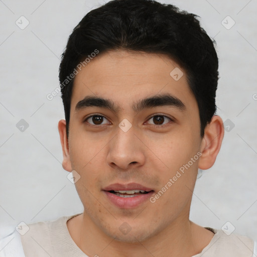 Joyful asian young-adult male with short  black hair and brown eyes