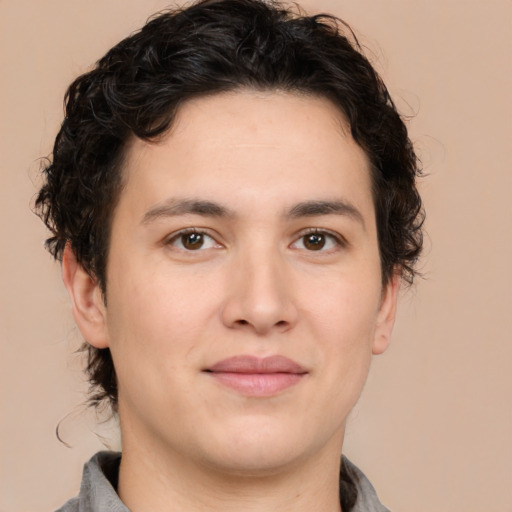 Joyful white young-adult male with medium  brown hair and brown eyes