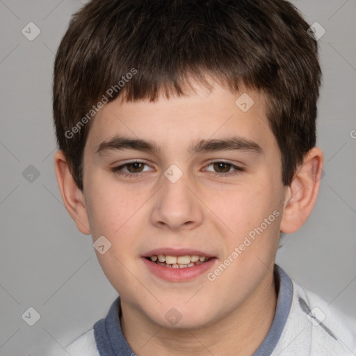 Joyful white child male with short  brown hair and brown eyes