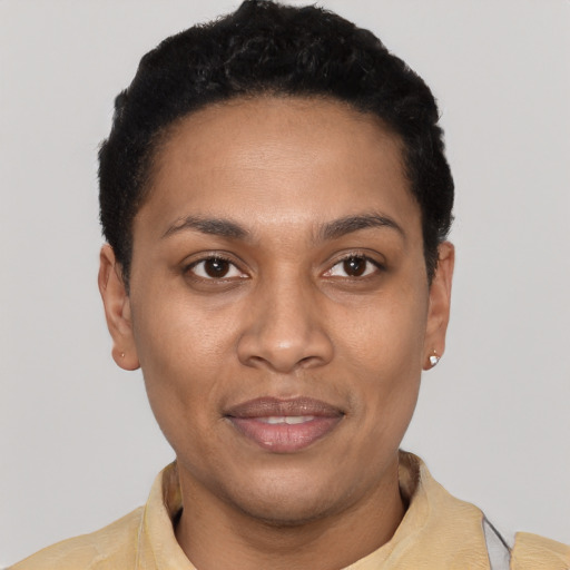 Joyful latino young-adult female with short  black hair and brown eyes