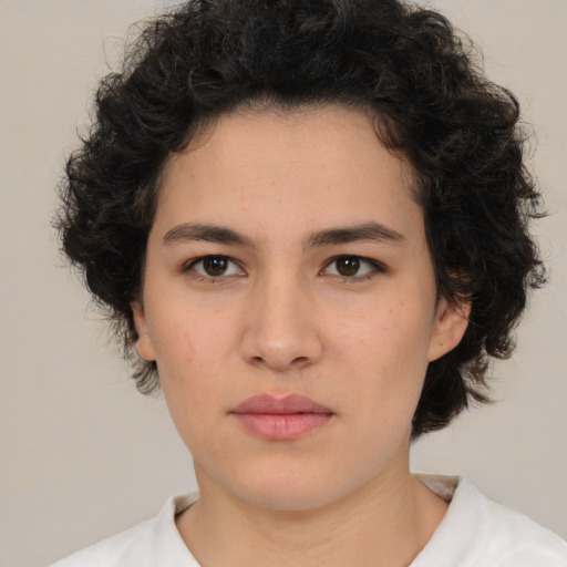 Neutral latino young-adult female with medium  brown hair and brown eyes