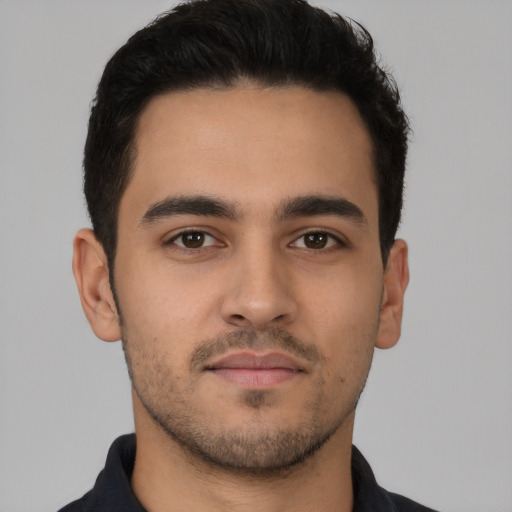 Neutral latino young-adult male with short  brown hair and brown eyes