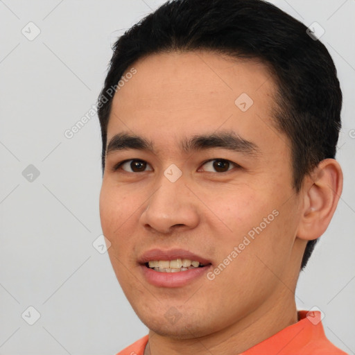 Joyful white young-adult male with short  black hair and brown eyes