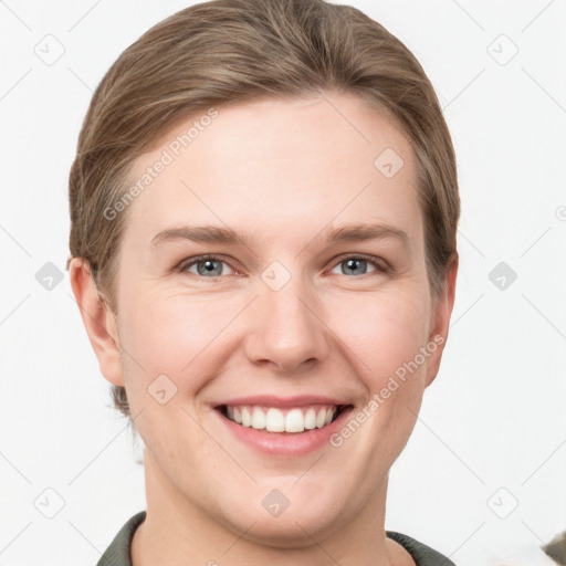 Joyful white young-adult female with short  brown hair and grey eyes