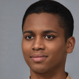 Joyful black young-adult male with short  brown hair and brown eyes