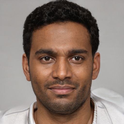 Neutral black young-adult male with short  black hair and brown eyes